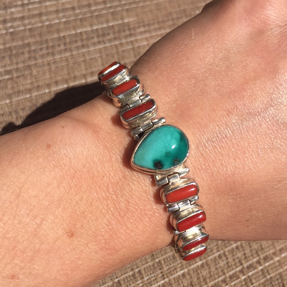 Silver bracelet with turquoise and corals.